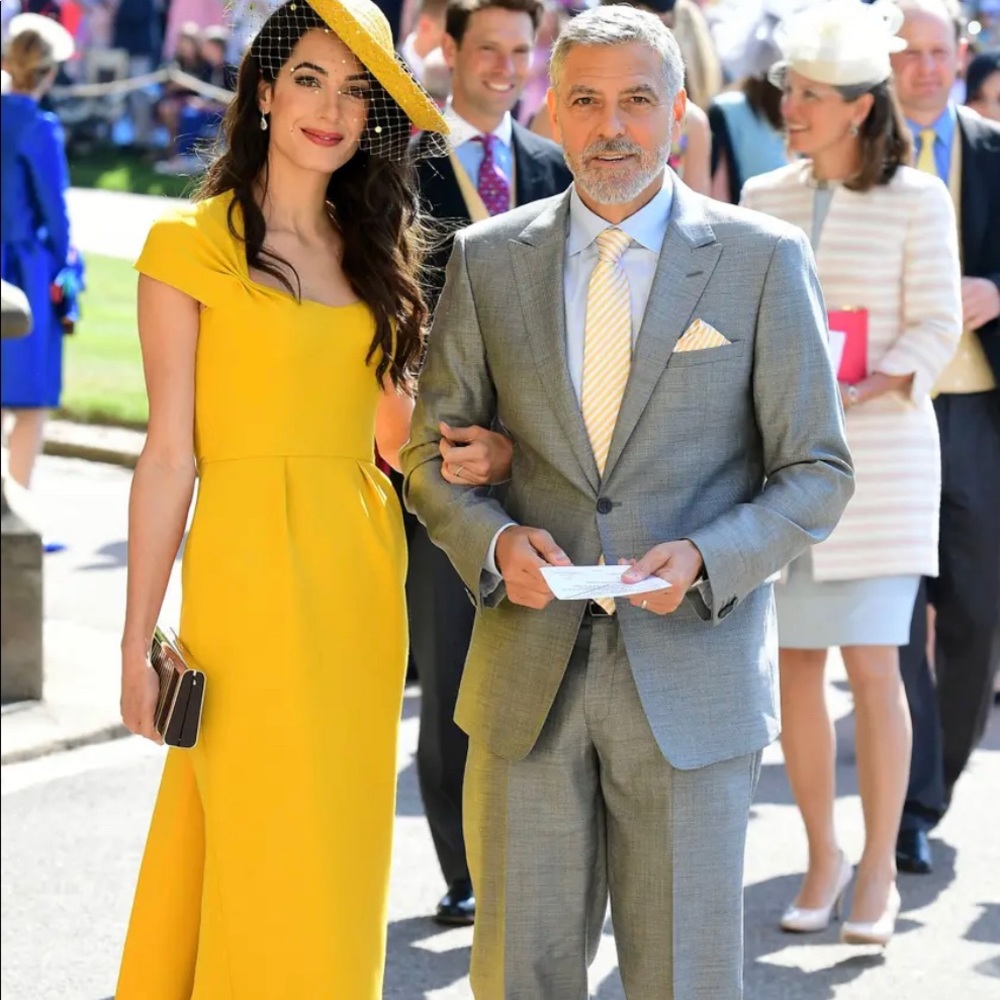 Stella McCartney yellow dress worn by Amal Clooney at Prince Harry’s wedding.